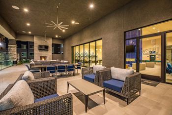 Outdoor seating in Wooden table chair at Level 25 at Sunset by Picerne, Las Vegas, NV
